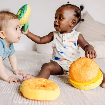 Melissa & Doug Pineapple Soft Stacker for baby. 2 babies playing with soft stacker pieces. - Little Gift Nook