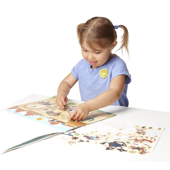 Melissa & Doug Reusable Sticker Pad Adventure. Showing child using the reusable stickers. - Little Gift Nook
