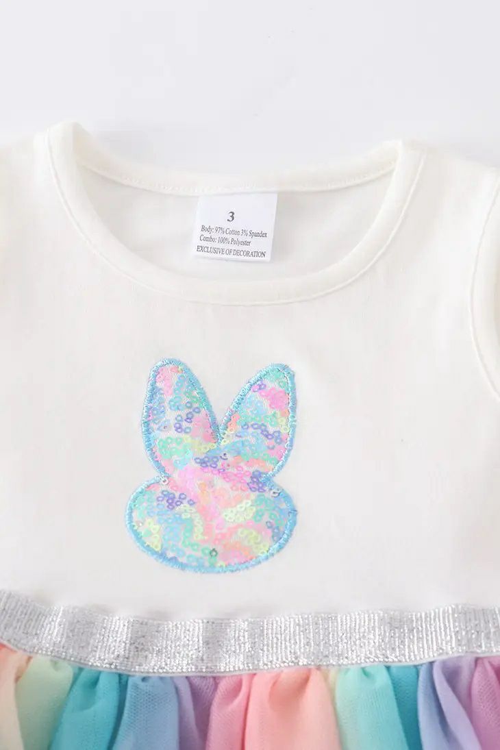 Bunny Sequin Rainbow Tutu Dress. Close up of front of dress. Sleeveless white bodice with pastel sequin bunny face on front.  - Little Gift Nook