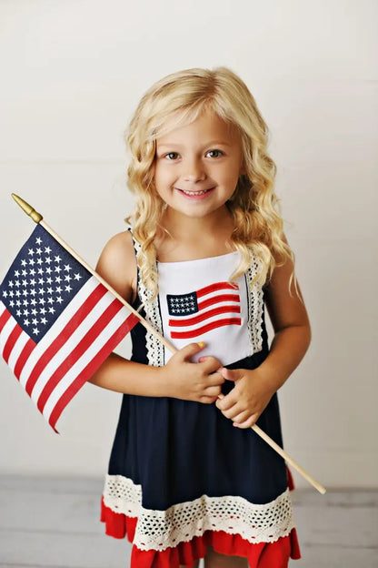 Patriotic Red White Navy Flag Crochet Hem Dress. Close up of front of dress with American Flag on front. - Little Gift Nook