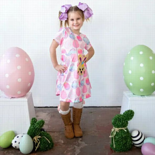 Pink Easter Egg Soft Twirl Dress. Pastel pink, blue, and purple Easter egg print buttery soft twirl dress. Little girl models it with pretty purple hair bows not included. - Little Gift Nook