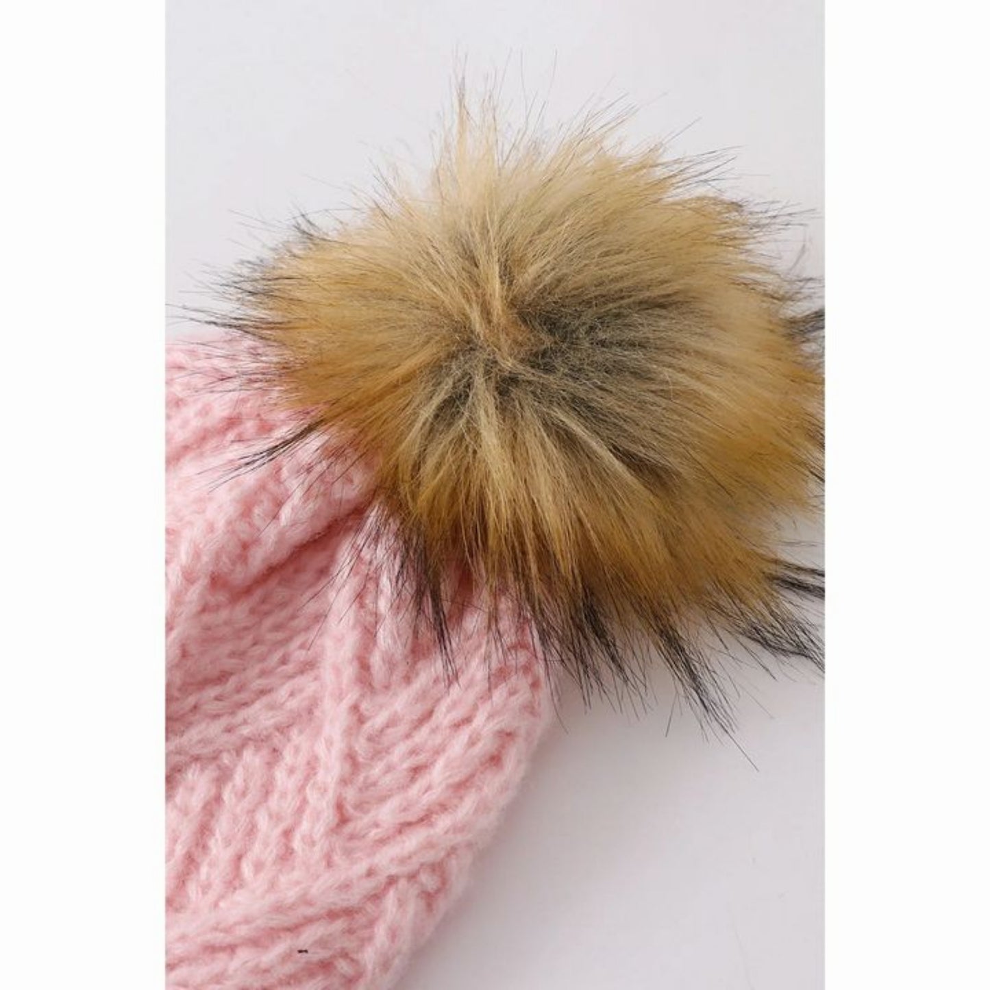 Close up of the faux fur pom pom on Pink Cable Knit Pom Hat- Little Gift Nook
