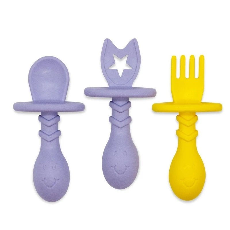 Lavender purple and yellow baby and toddler utensils, spoon and fork by the Teething Egg Company sitting on white background.