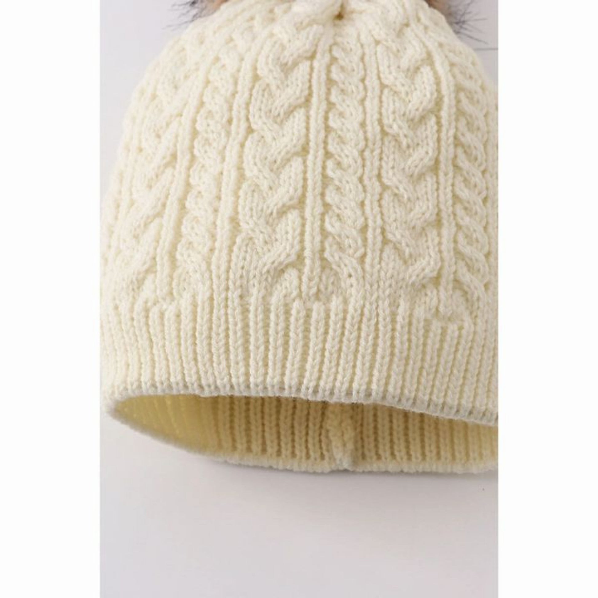 Close up of Cream cable knit pom pom beanie winter hat - Little Gift Nook