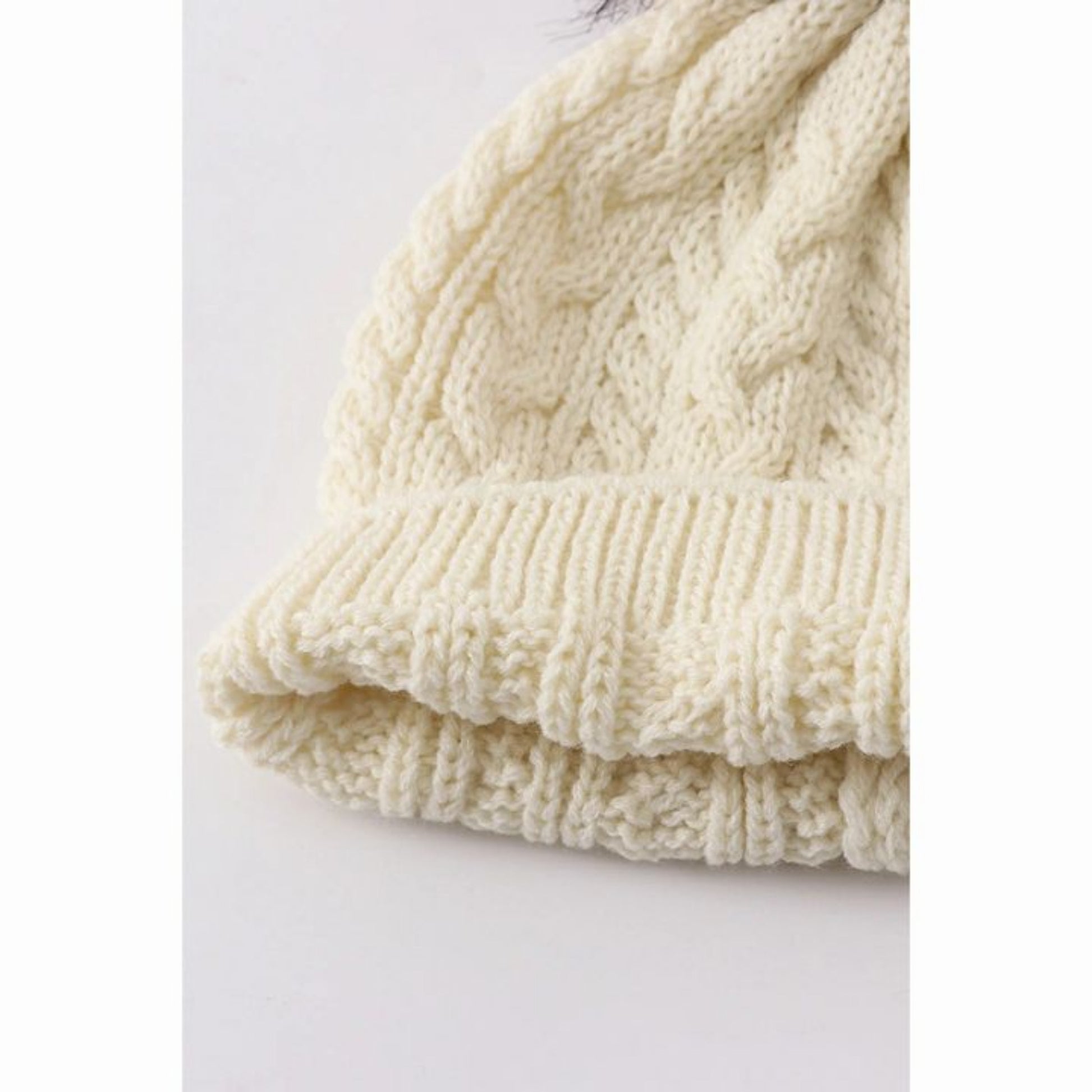 Close up of interior of Cream cable knit pom pom beanie winter hat - Little Gift Nook