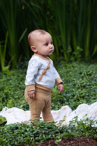 Organic Cotton white, gray, and tan grow with me baby bodysuit. Extra snaps so you get much longer use. Made in India. Pair with our tan grow with baby leggings.