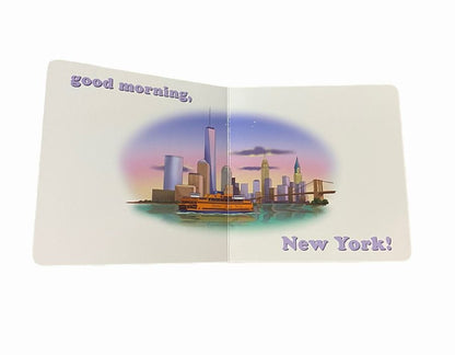 Inside baby board book "Goodnight Yankees" with NY skyline and says Good morning, New York! Book open sitting on white background.