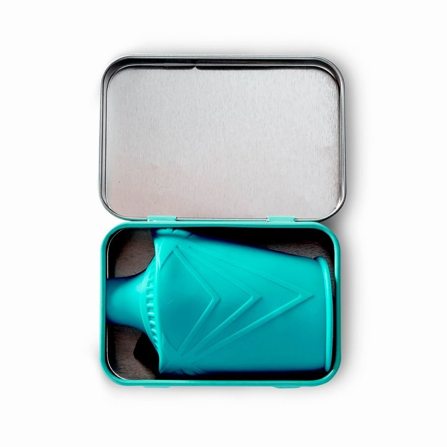 GoSili Universal Sippy Top lid in metal tin container storage on a white background. Little Gift Nook