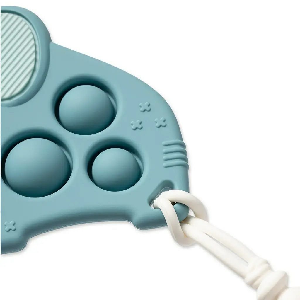 Close up of Itzy Pop blue elephant teether and popper toy with strap on a white background.