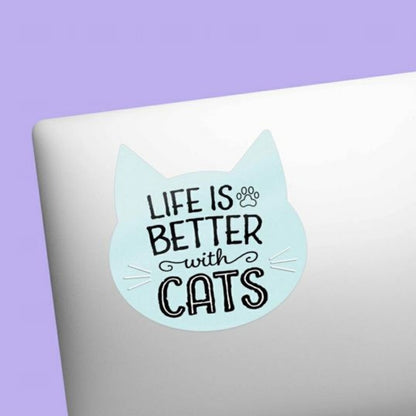 blue cat shaped "Life is Better with cats" waterproof sticker on front of laptop. 