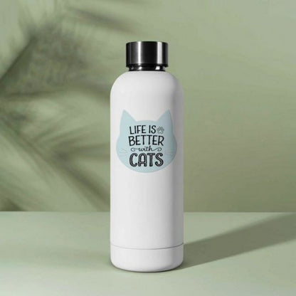 blue cat shaped "Life is Better with cats" waterproof sticker on white tumbler water bottle on green background.