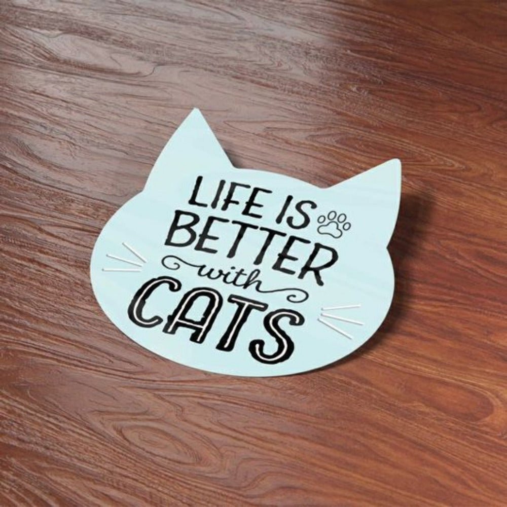 blue cat shaped "Life is Better with cats" waterproof sticker on wood surface background.