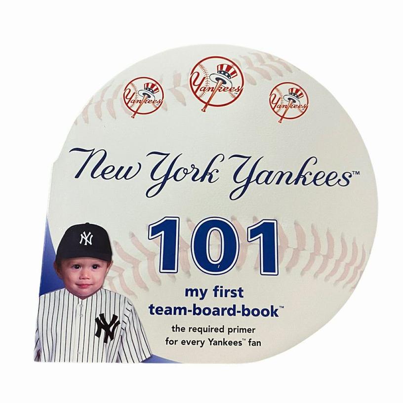 New York Yankees 101 Board Book shaped like round baseball with picture of baby on front cover sitting on white background.