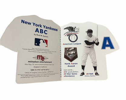 New York Yankees Alphabet Board Book turned open letter A with baseball player laying on white background.
