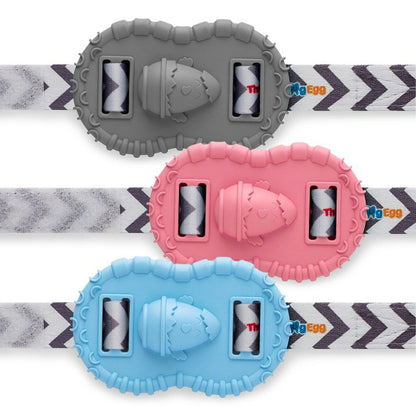 The Wristie baby wrist teether in gray, pink, and blue with straps on a white background.