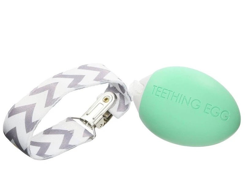 Mint Green egg shaped baby teether The Teething Egg with gray white pattern strap on a white background.  Little Gift Nook