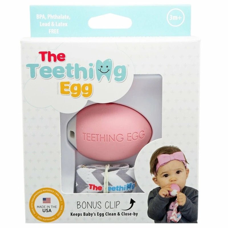 The Teething Egg pink egg shaped teether in package box on a white background. Little Gift Nook