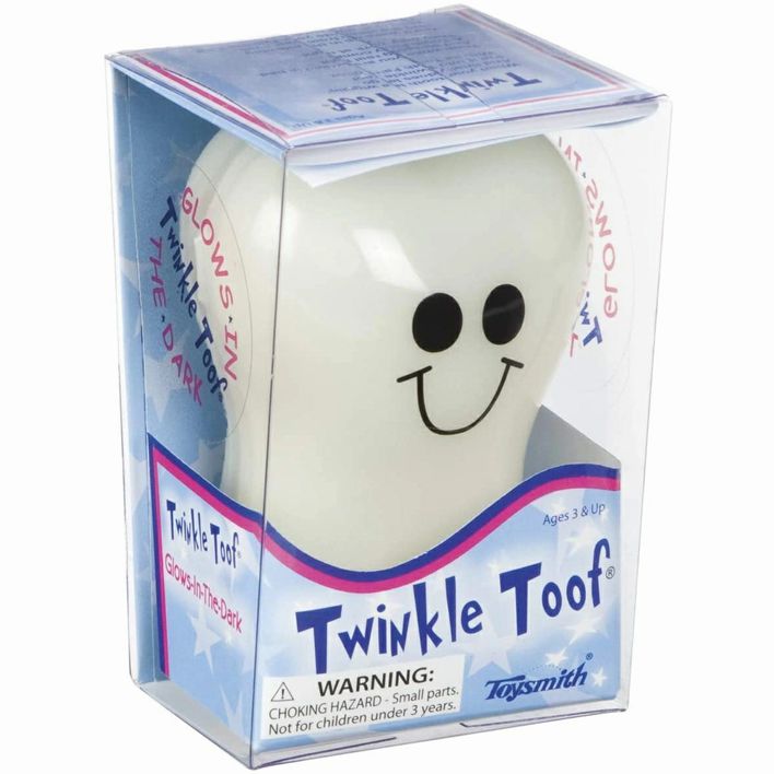 Twinkle Toof Toothfairy glow in the dark tooth keeper in package on white background. 