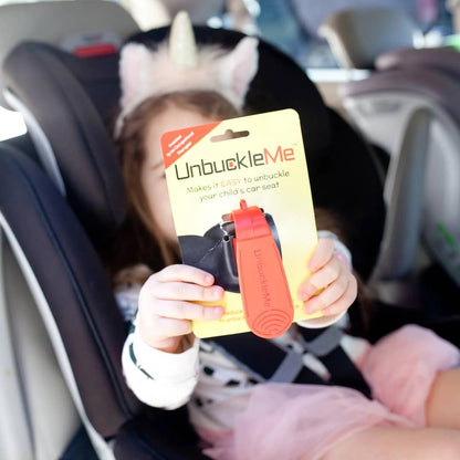 Unbuckle Me Car Seat Buckle Release being held up by baby. Little Gift Nook.